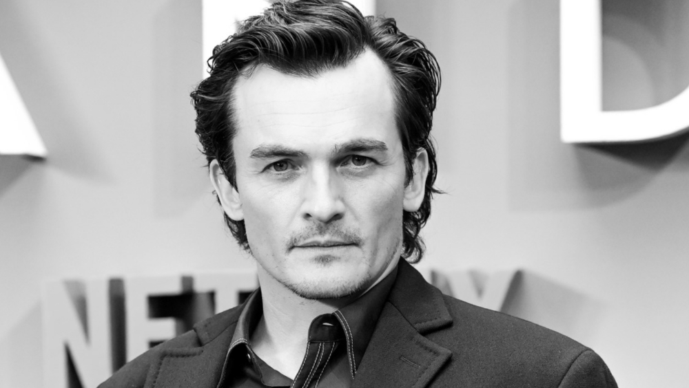 ‘Asteroid City’s’ Rupert Friend: ‘Maybe I’ve Got the Scars and the Bruises Now’ to Play James Bond