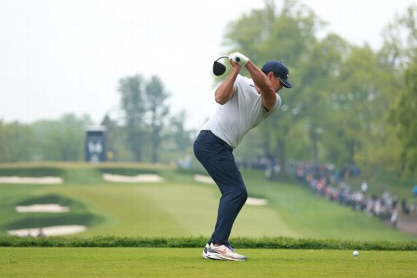 Koepka toughs through rainy round to take lead