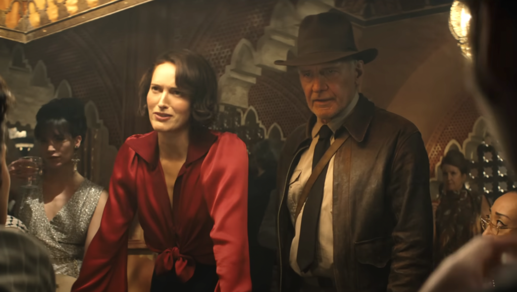 Harrison Ford Playfully Smacked Phoebe Waller-Bridge on the Head With Rolled Up Script on ‘Indiana Jones 5’ Set: ‘It was Hysterical’