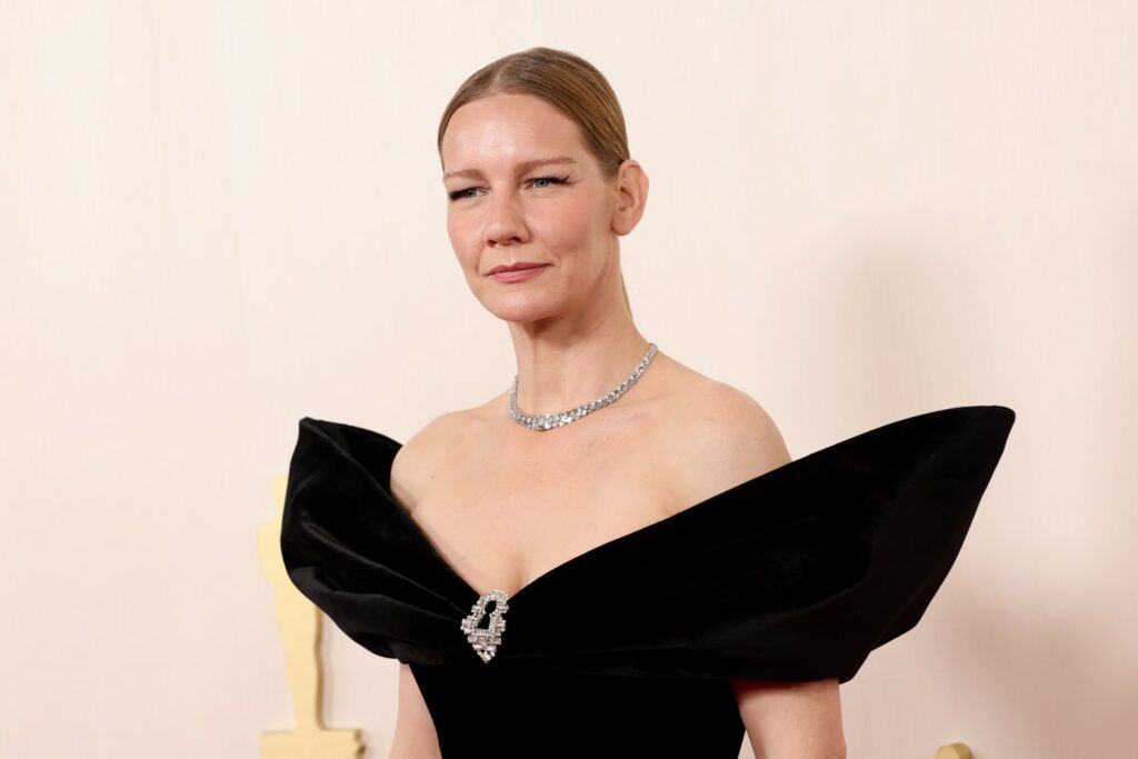 Sandra Hüller Pairs Schiaparelli Gown With Benefit Makeup (And $270 Moisturizer) At the 2024 Oscars